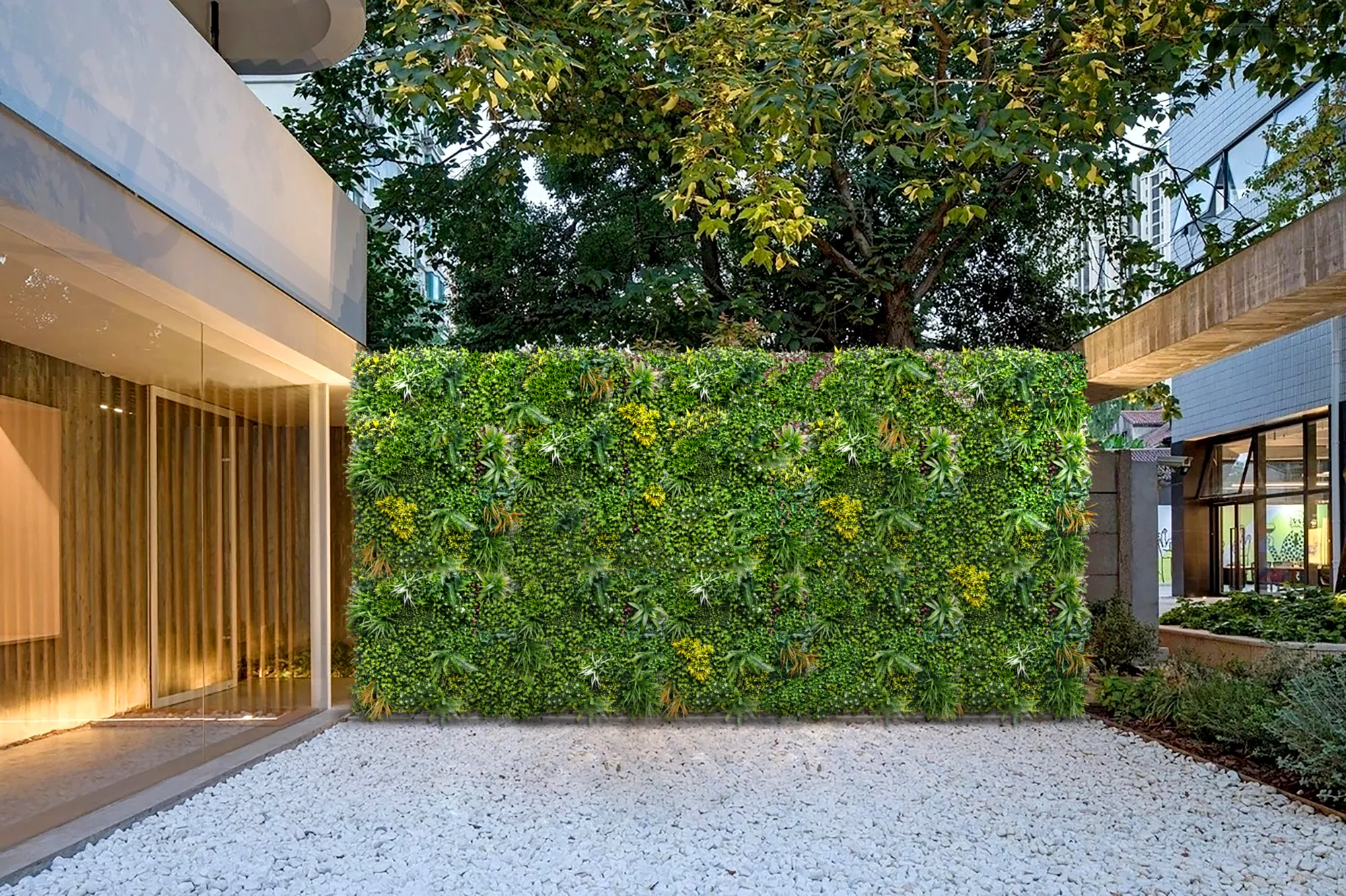 A courtyard wall covered in artificial green panels